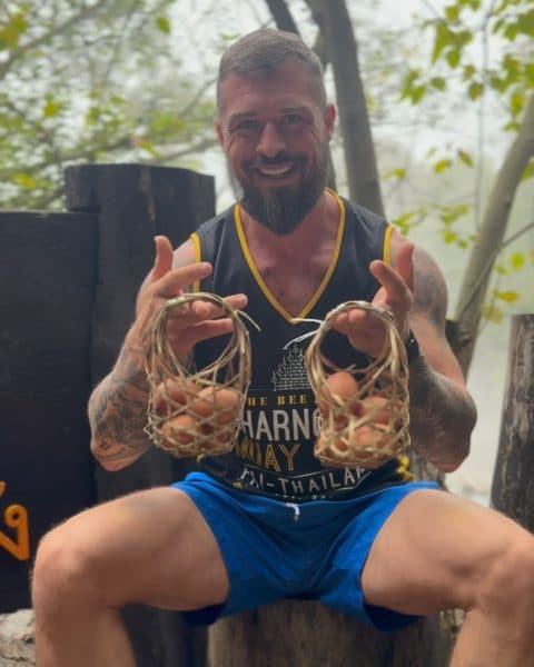 Rob holding up baskets of eggs cooked in the hot springs